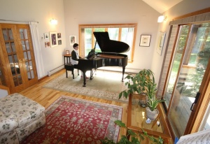 Photo of sunny room with a grand piano