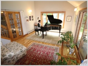 Photo of sunny room with a grand piano